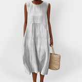 Elegante vestito estivo in cotone senza maniche con tasche