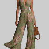 Amelia – tuta plissettata verde a fiori