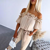 Nikola – Elegante tuta con spalle scoperte e cintura in vita