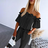 Nikola – Elegante tuta con spalle scoperte e cintura in vita